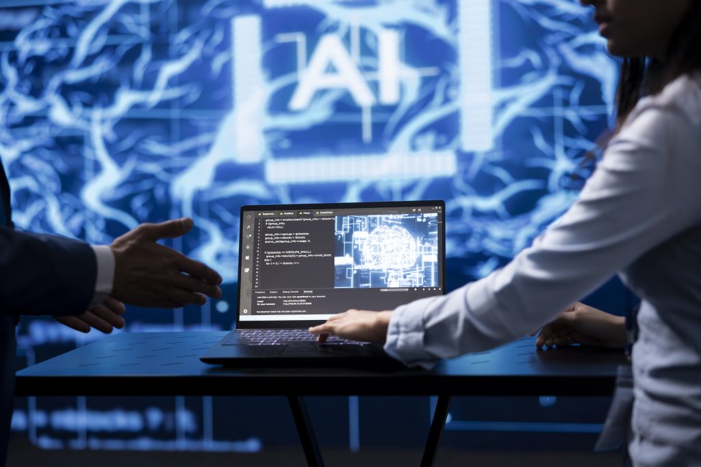 Computer scientist running AI cognitive computing tech on laptop