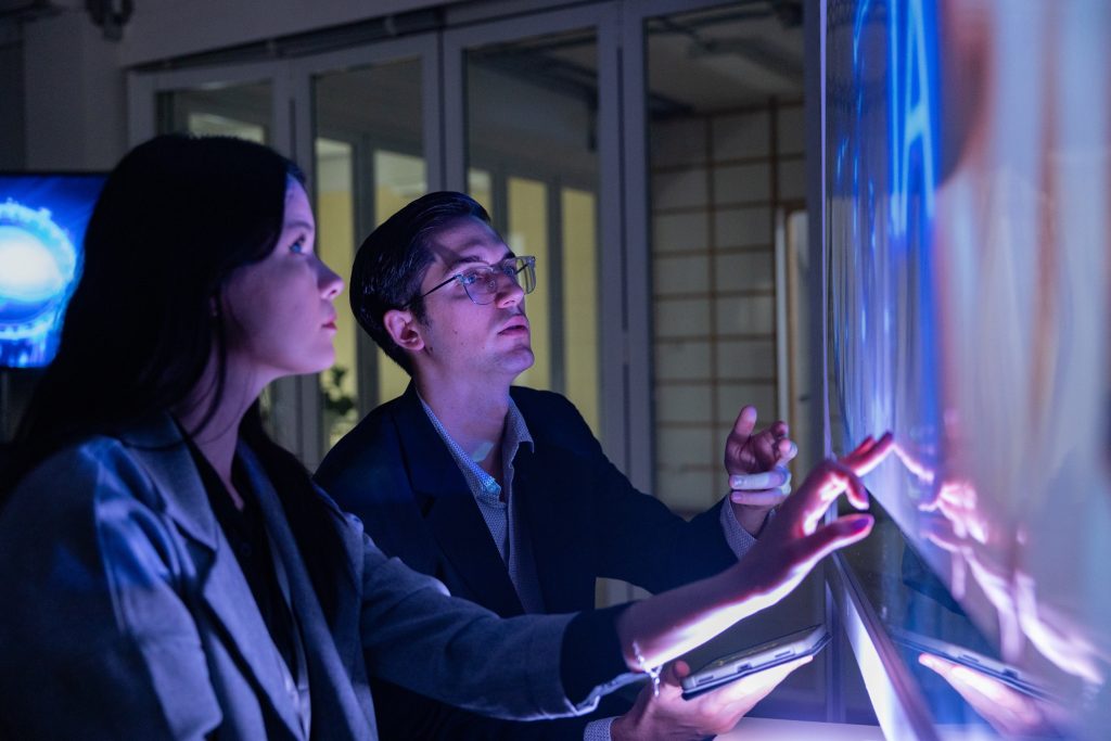 Team Collaborating on Interactive AI Touchscreen